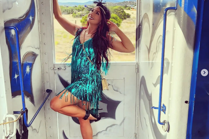 a woman standing in front of a door